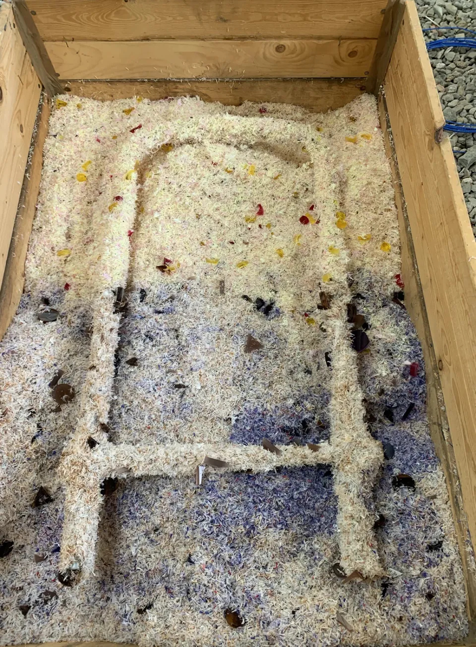 Chair frame in the coating box during hot fusion